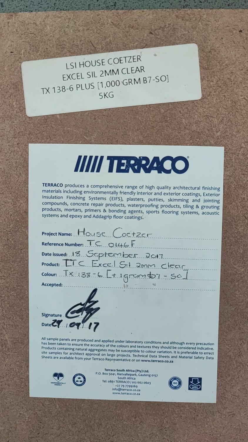 The signed Terraco sample card kept on site: project House Coetzer, product Terracoat Excel Sil 2 mm, colour TX 138-6, ref. TC 0146F. The finish on this building is traceable to an approved sample panel.