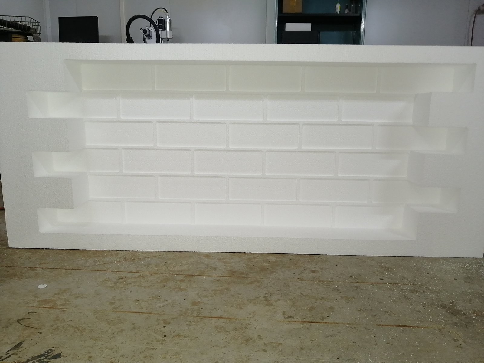 EPS panel CNC-milled with a running-bond brick pattern
