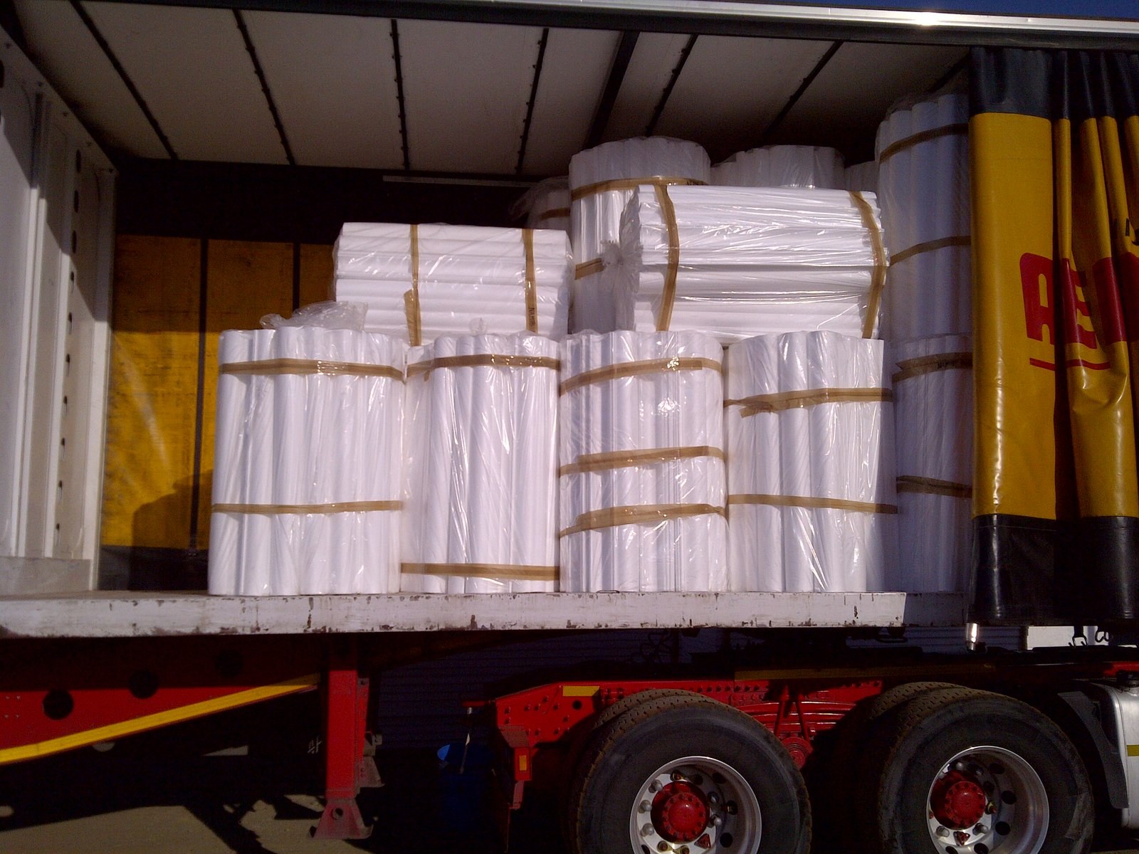Moulded EPS pipe shells bundled for delivery. Each section is cut to the bore and wall thickness the job asked for, so nothing is fabricated on site.