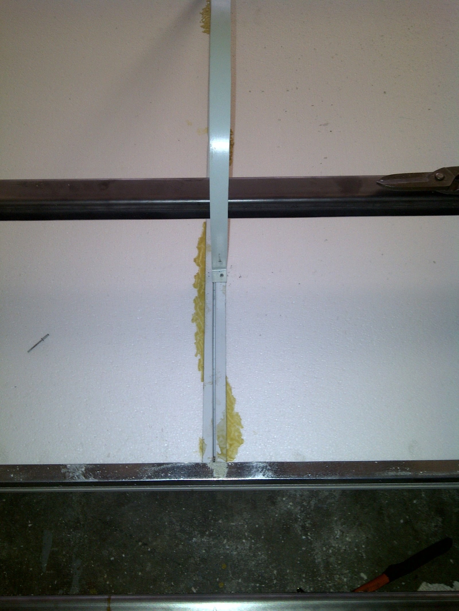Close-up of a panel edge joint with adhesive applied along the seam