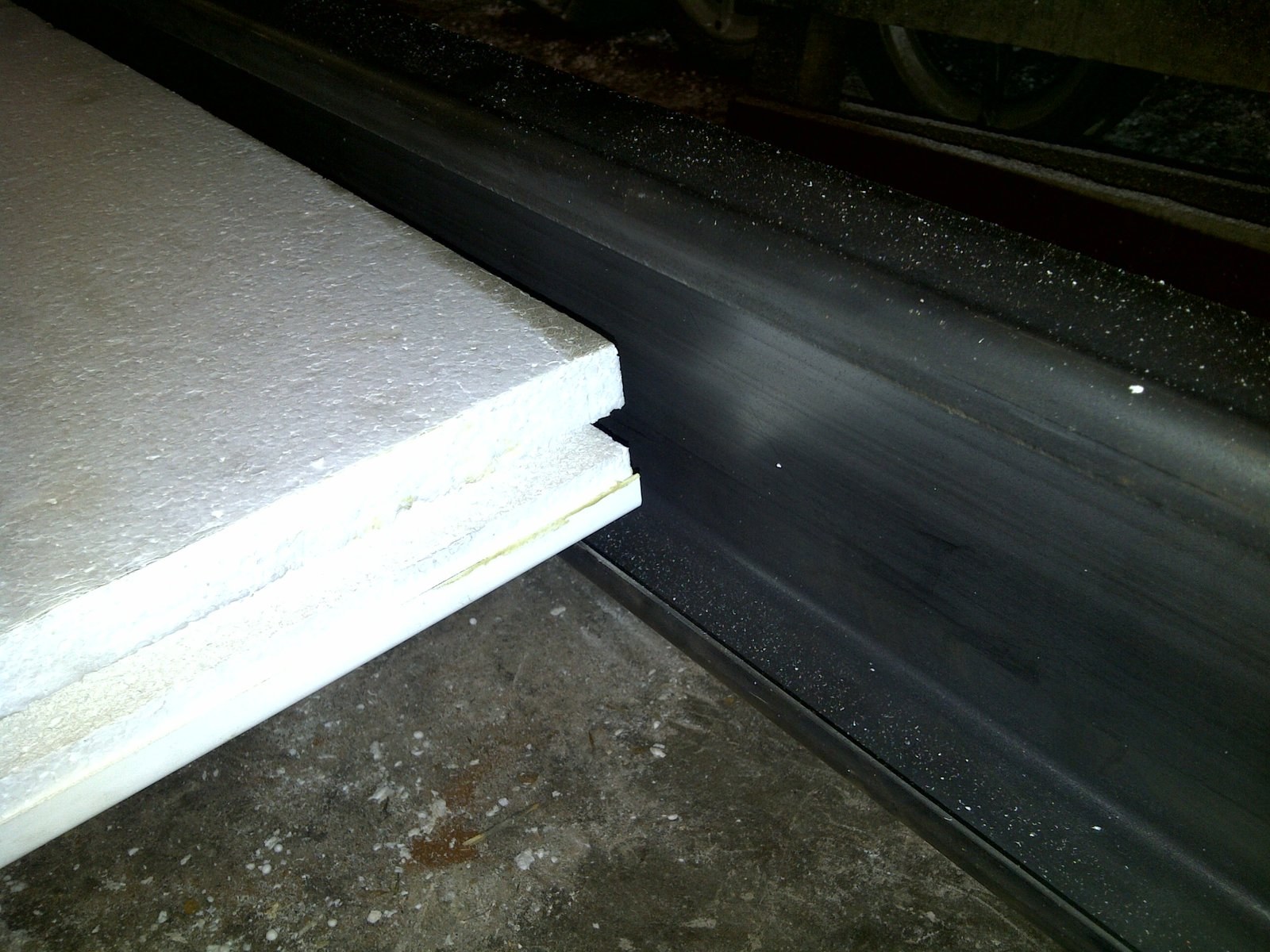 Close-up of a tongue-and-groove edge profile on an EPS panel