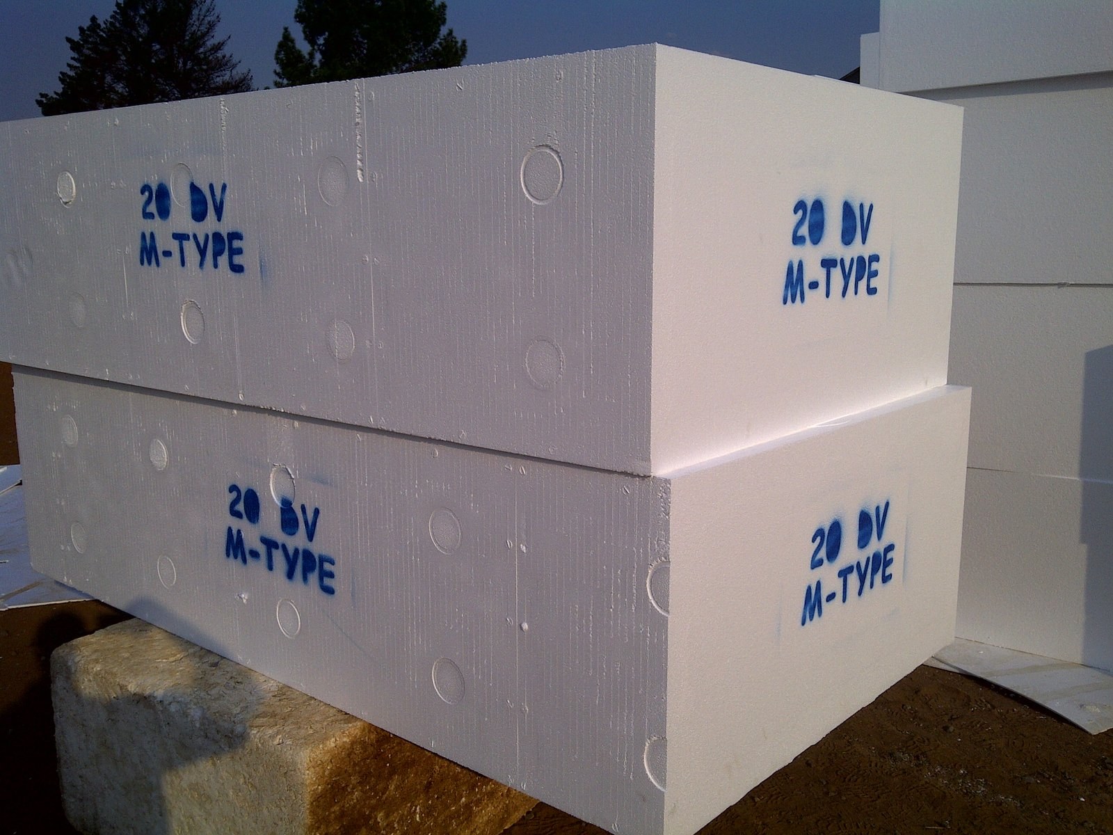 Two 20 DV M-Type void former blocks stacked outdoors, product code sprayed on the end face