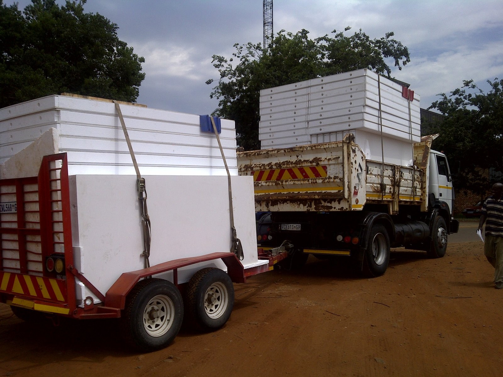 Two truck-and-trailer loads of void former blocks strapped for delivery