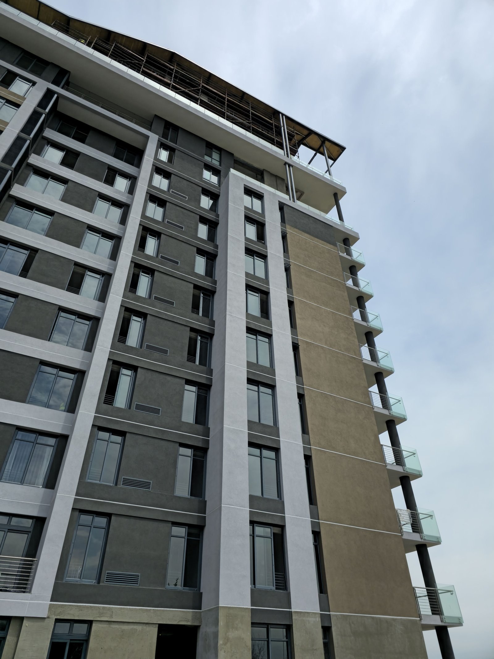 Completed render facade on a high-rise residential tower